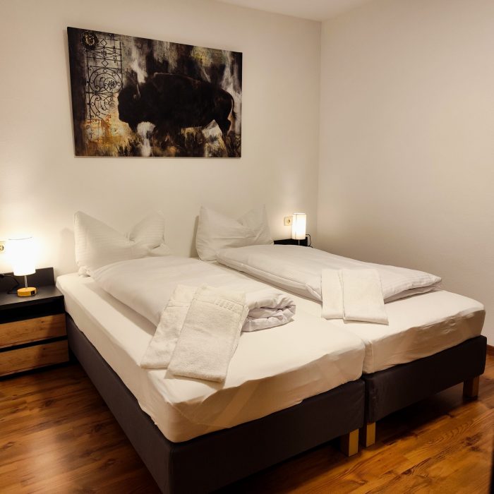 Gästehaus Munk Wohnung Nau Schlafzimmer zusammengestellte Betten